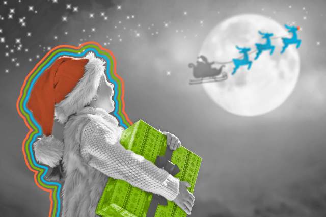 Santa Claus flying in his sleigh against moon sky