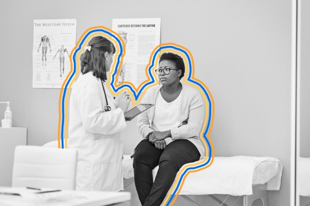 Doctor talking to a patient sitting on the examination table