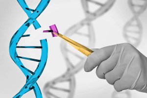 Hand removing small piece of DNA double helix structure