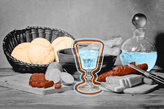 Antique still life with meat, sausages, salami, lard and a glass of vodka