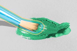 Paint brush painting green-blue color onto canvas