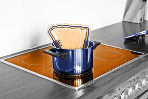 Spaghetti in a pot on an induction stove