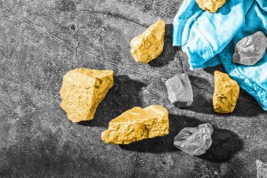 Nuggets of gold scattered across a surface
