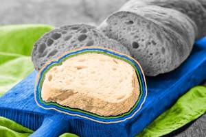 Freshly baked ciabatta bread on a cutting board