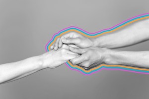 Person holding someone else's hand in their hands