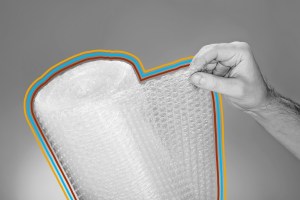 Person holding roll of bubble packing