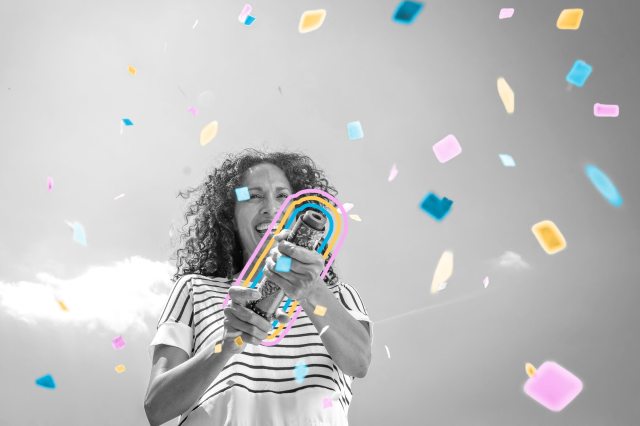 Woman exploding confetti
