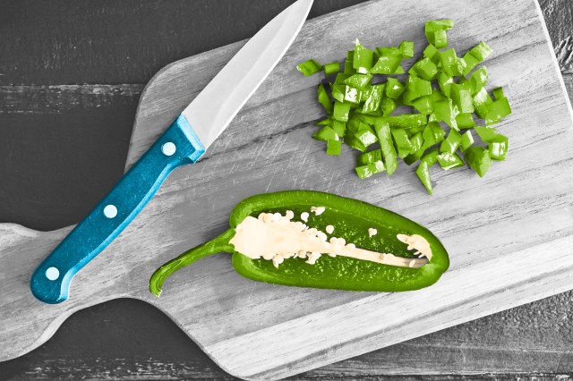 Jalapeño pepper diced on a cutting board