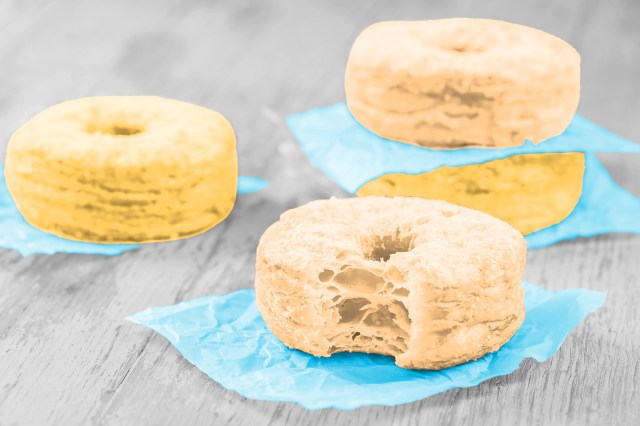 Cronuts sitting on tablec