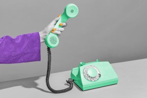 Hand holding receiver of a rotary phone